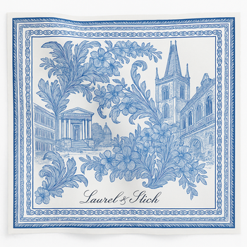 Decorative blue and white patterned scarf with architectural elements and 'Laurel & Stich' branding.
