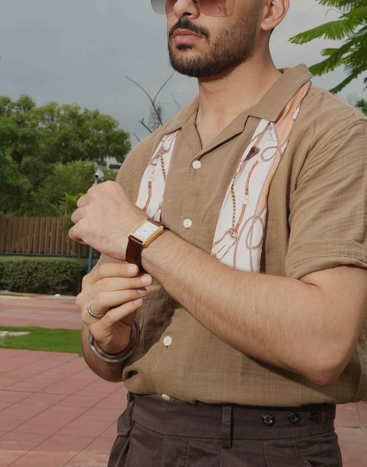 Man wearing a Twilly Scarf